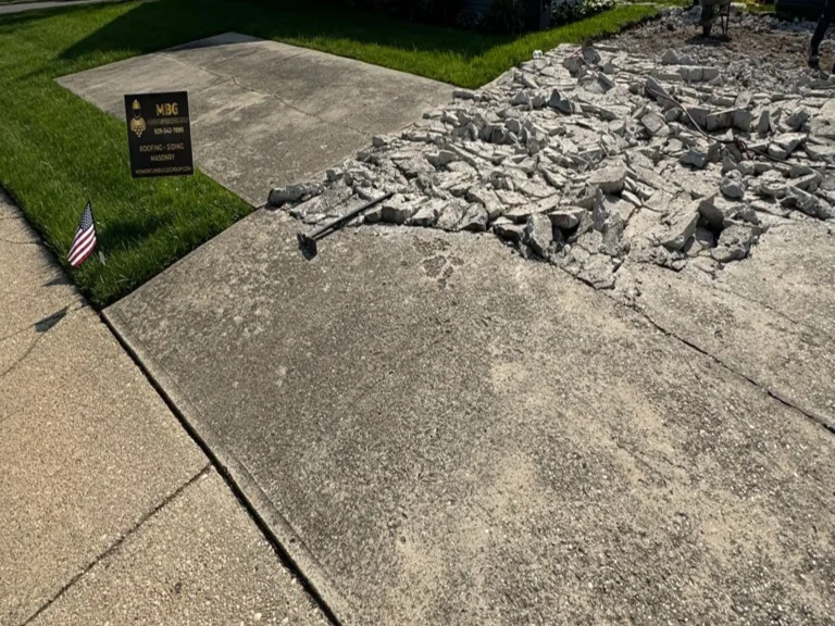 Old concrete driveway broken out for replacement